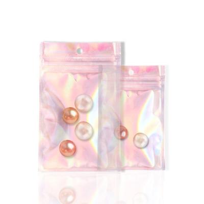 China Barrier Shenzhen Star Glitter Holographic Clear Window Flat Pack Bags Small Mylar Laser Cosmetic Bag With Zipper Top for sale