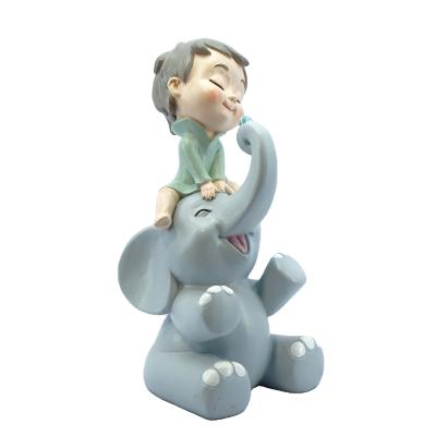 China World's Top Grace 11 Inch Home Decoration Kids Gift Customized Resin Handsome Boy With Elephant Happy Baby Shower for sale