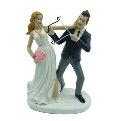 China Funny Wedding Cake Topper Cake Topper Resin Love Bride And Groom With Cupid's Arrow for sale