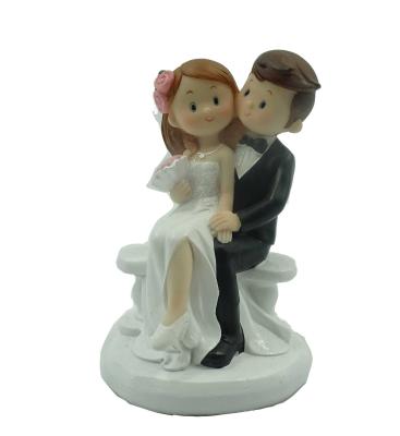 China Wedding Cake Topper Wedding Couples Cake Toppers Polyresin Romantic Cartoon Bride And Groom Figurine for sale