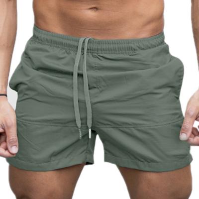 China Sustainable European and American Foreign Trade Solid Color European and American Beach Pants Men's Tied Shorts for sale