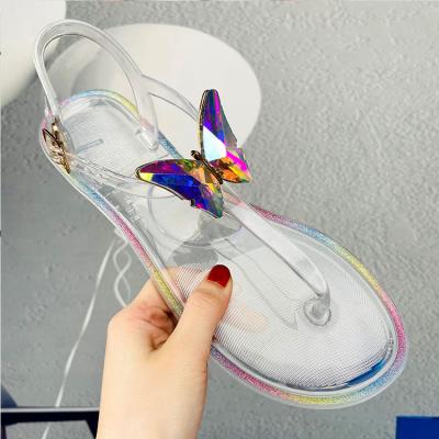 China Fashion trend summer fashion trend butterfly diamond jelly slippers PVC women leisure flat bottom outdoor beach sandals transparent crystal shoes for sale