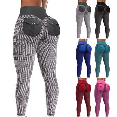 China Custom Breathable Honeycomb Yoga Pants Pockets Tights Peach Hip Women's Fitness Gaiters High Waist Lift for sale