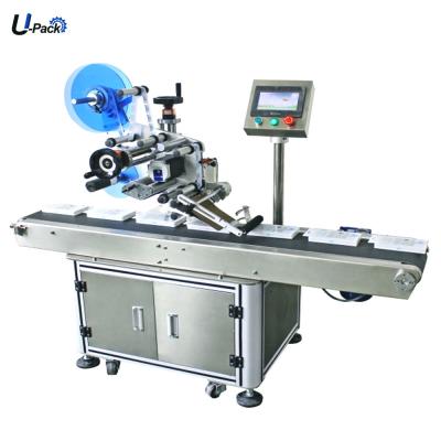 China CLOTHING automatic food packages labeling machines automatic flat labeling machine for food pouches flat labeling machine for food bags for sale