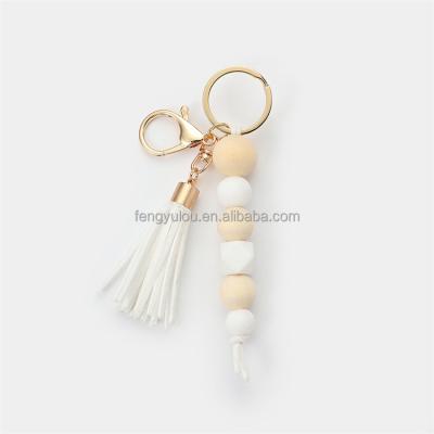 China New Fashion Design Custom Beaded 2022 Wooden Bead Bracelet Tassel Silicone Key Chain for sale