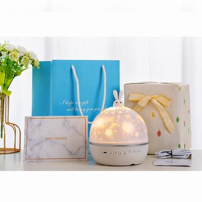 China 2021 Modern New Creative Projection Moon Light Bedroom Bedside Lamp Christmas Gift Music Box Night Light for sale