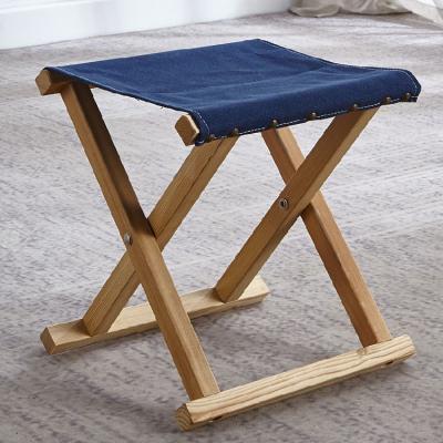 China Modern fashion indoor wood pure color height canvas material simple folding chair for sale