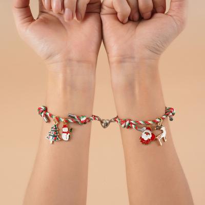 China FASHIONABLE Popular Snowman Elks Tree Santa Claus Christmas Love Magnet Couples Hand Rope Pendant Bracelets for sale