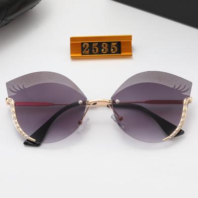 China 2022 New Fashion Luxury Women's Frameless Sunglasses Metal Shades Cat Eye Glass Women Shades Sunglasses Retro Sunglasses for sale