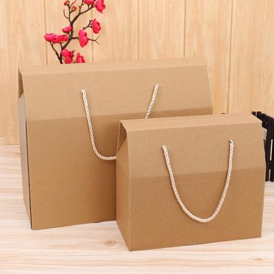 China Custom Wholesale High Quality Handmade Disposable Logo Reasonable Corrugated Kraft Paper Cardboard Packaging Box With Handle for sale