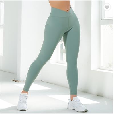 Китай Cross Waist Outdoor Jogging Skinny Comfortable Women's Breathable Yoga Leggings With Custom LOGO продается