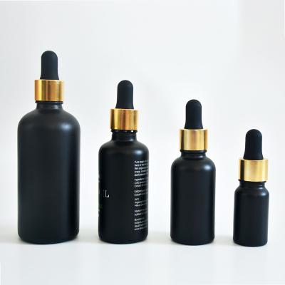 China Pharmaceutical wholesale matte dropper 30ml bottle 100ml 60ml 15ml 10ml essential oil amber black glass bottle with hot stamping for sale