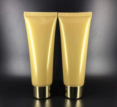 China 100g Cosmetics Gold Plastic Cosmetic Tube High Quality Body Cream Tube for sale