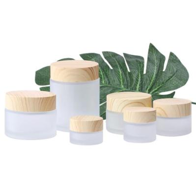 China Eco - Friendly Glass Cosmetic Packaging Container Jar Cream Glass Jar With Bamboo Lid for sale