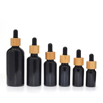 China Customized Personal Care Made 30ml Bamboo Black Glass Oil Facial Essence Dropper Bottle And Cream Jar Set Cosmetic Packaging for sale