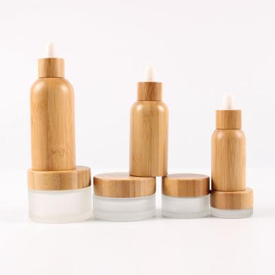 China Eco-friendly Recyclable Hot Sales Essential Oil Bamboo Glass Dropper Bottles With Custom Logo Silk Screen Printing And Engraving Logo for sale