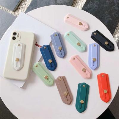 China Solid Color Fashion Wristband Push And Pull Mobile Phone Holder Shield Bracket/Bracket/Handle Triangle for sale