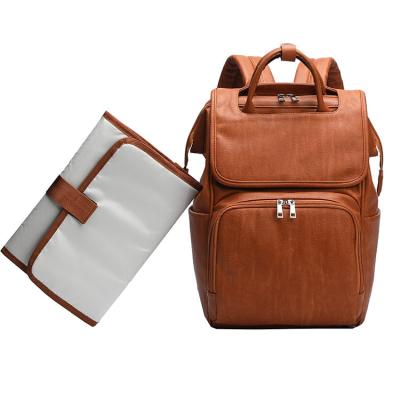 China With USB PU Leather Diaper Bag Backpack Diaper Bag Baby Bags For Mom Unisex Maternity With Stroller Hanger for sale