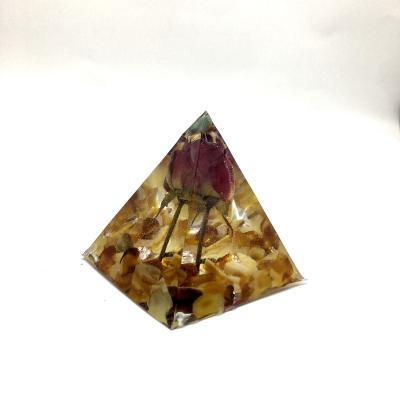 China Customized Pyramid Hand Made From Europe 5cm Beautiful Amber Resin Chip Flower Orgone For Decoration for sale