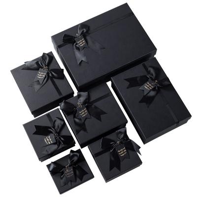 China Handmade Custom Size Large Classic Black Kraft Paper Cardboard Paper Bag Packaging Gift Box for sale