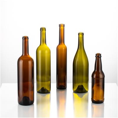 China Wine Cheap Wholesale Empty Clear Brown Glass Wine Bottles With Cork for sale