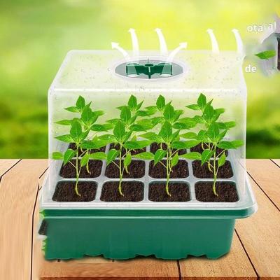 China Seedling cultivation Customized 5 Pack 12 Cells Seed Nursery Starter Trays with Plant and Dome Tray Greenhouse Box Starter Set for sale