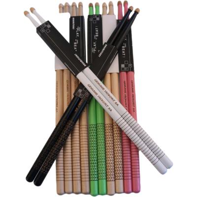 China Popular Wholesale Percussion Accessories 5A Drum Sticks Natural Wood Color Engraved Texture Laser Logo Anti-Slip Hickory Drumstick for sale