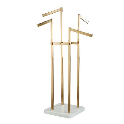 China Clothing Store Dresses Rack Blade Arm Art Rack Free Standing Hanging Clothing Display Unit Creative Rack 4 Way for sale