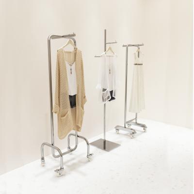 China Clothes Shop Retail Clothing Display Rackswith Rolls Stainless Metal Mobile Clothing Rolls Block Display for sale