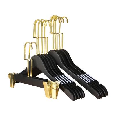 China Minimalist Customized Logo Clip Coat Hanger Solid Wood Luxury Black Clothes Hanger Wooden Non Slip With Gold Hooks for sale