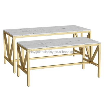 China Shops Gold Nesting Bag Display Table With Black And White Marble Tops MDF Clothes Display Nesting Table Clothing Display Table for sale