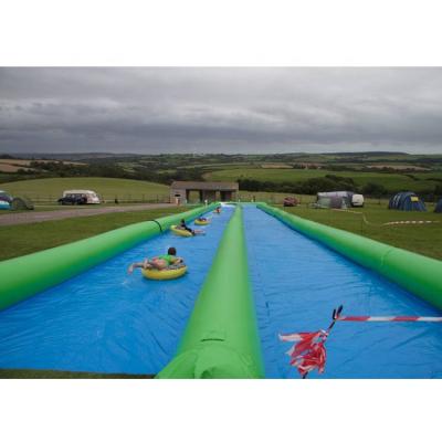 China 0.6mm PVC Tarpaulin 328ft Inflatable Slip N Slide City Inflatable Slide With Pool for sale