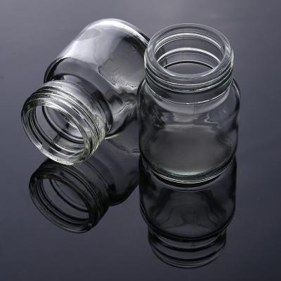 China Food Factory Customized Small Round Flint Food Storage Glass Jars And Bottles Wholesales For Spices Sauces Honey for sale