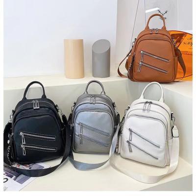 China SY 2022 new waterproof girls fashion trending PU leather lady bags backpack cute small girls travel school backpack for women for sale