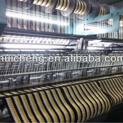 China Quanzhou Huicheng High Speed ​​Warp Flat Knitting Machine With EL System And Cutter-Presser for sale