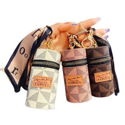 China Metal Key Chain Luxury Silk Scarves Leather Mini Lipstick Storage Bucket Bag Portable Key Chain for sale