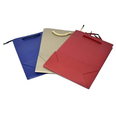 China Paper Packaging Bags Customize Gift Package Bag for Apparel Clothing for sale