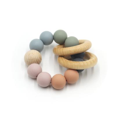 China NCYLIFE Organic Natural Silicone Bead Baby Teether Bracelet Toy with Wooden Ring Bpa Free for sale