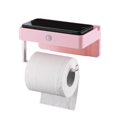 China Multi-functional Automatic Control LED Plastic Toilet Paper Holder With Phone Shelf for sale