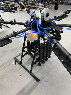 China Vier-assige 4-rotor UAV FOC Drive 3090 Opvouwbare schroef vastgebonden Drone met automatisch intrekbare slang spoel Kabel spoel Te koop