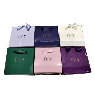 China New Design Cosmetic Gift Paper Shopping Bag With Handle Kraft Paper Craft Customized Bag for sale