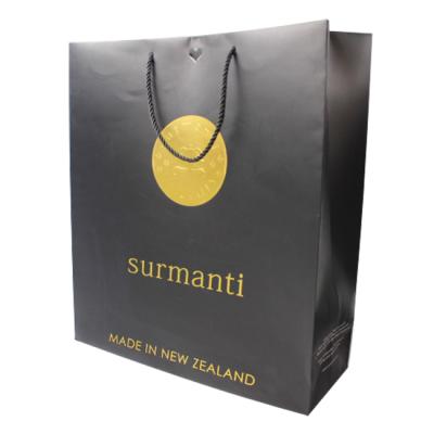 China Custom CYMK Gift Recyclable Eco-Friendly Black Paper Bag Printed Logo Clothing Packaging Bag Shopping Paper Bag With Ribbon Handles for sale