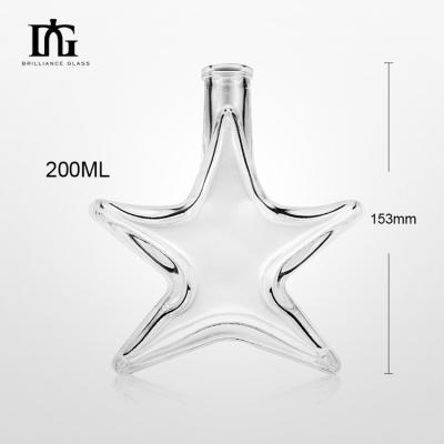 China Food Grade 250ml Glass Bottle Container with Cork Screw Cap in Creative Star Shape for sale