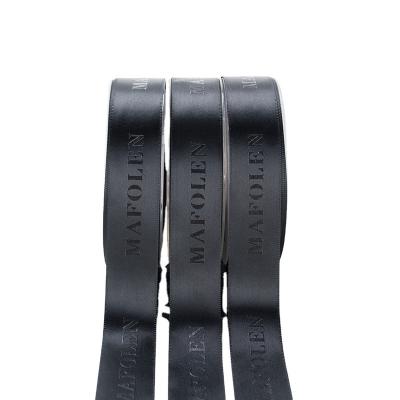 China Eco-friendly 100% Polyester Custom Black Embossed Logo Printing Black Satin Ribbon For Gift for sale