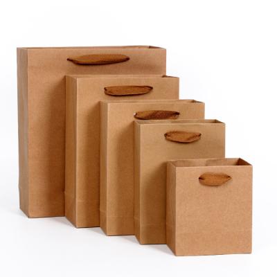 China Factory Supply Recyclable Brown Kraft Paper Clothes Packaging Shopping Bag With Ribbons for sale