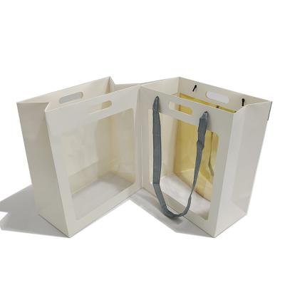 China Popular Products Recyclable Stretch Open Window Transparent Gift Bag Thickened Color Portable Paper Bag for sale