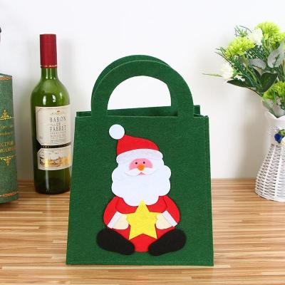 China Hot Selling Christmas Gift 2021 Small Portable Felt Gift Bags Santa Gift Christmas Candy Felt Bags For Kids for sale