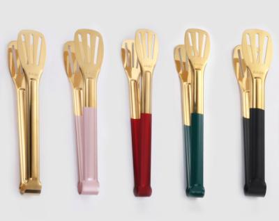 China Viable Metal 304 Gold Stainless Steel Food Bread Steak BBQ Grill Cooking Tools Brass Fishing Tongs Clip With Color Handle for sale