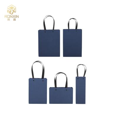 China Hot Stamping Recycled Paper Gift Bag Newest Logo Materials Popular Custom Blue Paper Business Shopping Bag With Handles for sale