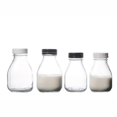 China Beverage KDG Customize Factory Supply 350ml 500ml Transparent Flint Hot Sale Glass Beverage Bottles With Lids for sale